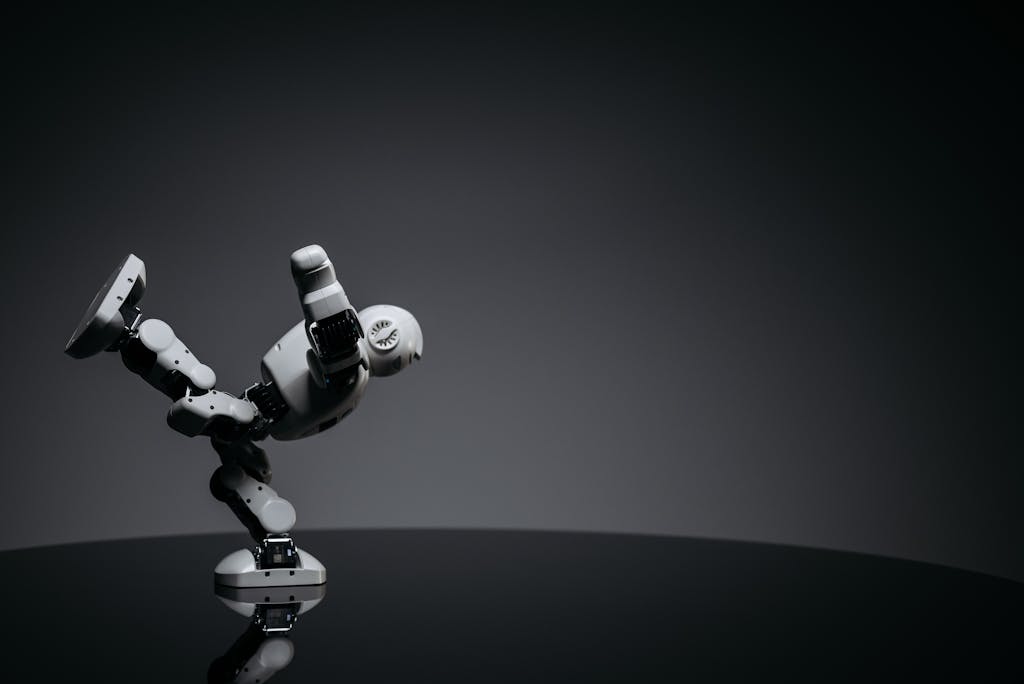 AGI - Minimalist photo of a toy robot balancing creatively in a studio setting.